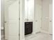 Well-lit bathroom with dark vanity and granite countertop at 4321 Sw 52Nd Lane Rd, Ocala, FL 34474