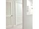 Clean and bright hallway with white doors and light gray walls at 4321 Sw 52Nd Lane Rd, Ocala, FL 34474