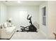 Home gym with an elliptical machine and a sofa at 4321 Sw 52Nd Lane Rd, Ocala, FL 34474