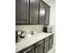 Kitchen with dark cabinetry and granite countertop at 4321 Sw 52Nd Lane Rd, Ocala, FL 34474