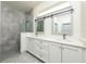 Modern bathroom with a large glass shower and double vanity at 4721 Se 25Th Loop, Ocala, FL 34480