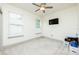 This bedroom features two windows for natural light and a ceiling fan at 4721 Se 25Th Loop, Ocala, FL 34480