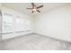 Cozy bedroom with plantation shutters on the windows and neutral carpet flooring at 4721 Se 25Th Loop, Ocala, FL 34480