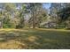 Serene backyard showcasing a home nestled amongst the trees at 5000 Se 11Th Ave, Ocala, FL 34480