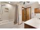 Bathroom with shower/tub combo and double vanity at 5000 Se 11Th Ave, Ocala, FL 34480