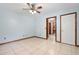 Bright bedroom featuring tile floors and a ceiling fan at 5000 Se 11Th Ave, Ocala, FL 34480