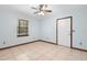 Spacious bedroom with light walls and ceiling fan at 5000 Se 11Th Ave, Ocala, FL 34480