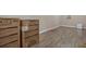 Empty room with wood-look flooring and new appliance boxes at 5000 Se 11Th Ave, Ocala, FL 34480