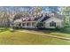 Spacious home with a long walkway and lush landscaping at 5000 Se 11Th Ave, Ocala, FL 34480