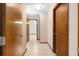 Bright hallway with wood doors and tile floors at 5000 Se 11Th Ave, Ocala, FL 34480