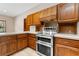 Kitchen features stainless steel appliances and wood cabinets at 5000 Se 11Th Ave, Ocala, FL 34480