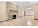 Living room features a stone fireplace and tile flooring at 5000 Se 11Th Ave, Ocala, FL 34480