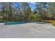 Inviting kidney-shaped pool with expansive patio, perfect for relaxation at 5000 Se 11Th Ave, Ocala, FL 34480