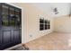 Covered porch with tile flooring and ceiling fan at 5000 Se 11Th Ave, Ocala, FL 34480