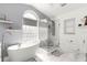 Large bathroom with a freestanding tub and a separate shower at 5137 Nw 20Th Pl, Ocala, FL 34482