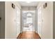 Hallway leading to a luxurious bathroom with a freestanding tub at 5137 Nw 20Th Pl, Ocala, FL 34482