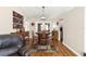 Rustic-chic dining room with unique barrel table and hardwood floors at 5137 Nw 20Th Pl, Ocala, FL 34482