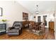 Well-lit dining area with a rustic table and comfortable seating at 5137 Nw 20Th Pl, Ocala, FL 34482