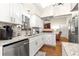 Well-equipped kitchen with granite countertops and white cabinetry at 5137 Nw 20Th Pl, Ocala, FL 34482