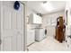 Clean laundry room with washer, dryer, and ample storage at 5137 Nw 20Th Pl, Ocala, FL 34482