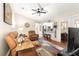 Relaxing living room with leather recliners and a view into the kitchen at 5137 Nw 20Th Pl, Ocala, FL 34482