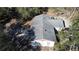 An aerial view shows the home's roof, surrounding trees, and outdoor patio area at 5625 Sw 181St Ct, Dunnellon, FL 34432