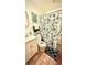 Bathroom featuring a vanity, toilet, and shower with a fun ocean-themed curtain at 5625 Sw 181St Ct, Dunnellon, FL 34432