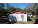 Simple, single-story home with a red roof at 5625 Sw 181St Ct, Dunnellon, FL 34432