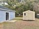 Backyard with shed and patio, perfect for outdoor enjoyment at 5739 Se 163Rd Ct, Ocklawaha, FL 32179