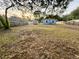 Large backyard with a shed and plenty of space for outdoor activities at 5739 Se 163Rd Ct, Ocklawaha, FL 32179