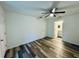 Bright bedroom with wood-look floors and ceiling fan at 5739 Se 163Rd Ct, Ocklawaha, FL 32179