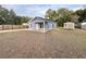 New construction home with a storage shed in the backyard at 5739 Se 163Rd Ct, Ocklawaha, FL 32179