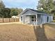 Newly built home, featuring a covered porch and a fenced backyard at 5739 Se 163Rd Ct, Ocklawaha, FL 32179