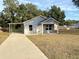 Newly constructed home with covered porch and spacious yard at 5739 Se 163Rd Ct, Ocklawaha, FL 32179