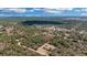 Scenic aerial view of the property with a home, shed, and lush greenery at 5885 Sw 169Th Ct, Ocala, FL 34481