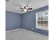 Bedroom with updated floors, a ceiling fan, and a window providing natural light at 5885 Sw 169Th Ct, Ocala, FL 34481