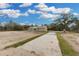 Inviting single-story home with a long driveway and ample space for parking at 5885 Sw 169Th Ct, Ocala, FL 34481