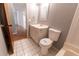 Small bathroom with a toilet and vanity at 6006 Nw 62Nd Pl, Ocala, FL 34482