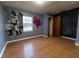 bedroom with wood-look floors and murals at 6006 Nw 62Nd Pl, Ocala, FL 34482