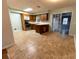 Kitchen features wood cabinets, tile floor, and view to backyard at 6006 Nw 62Nd Pl, Ocala, FL 34482