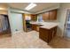 Galley kitchen with wood cabinets and stainless steel appliances at 6006 Nw 62Nd Pl, Ocala, FL 34482