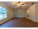 Living room with wood-look floors and access to the backyard at 6006 Nw 62Nd Pl, Ocala, FL 34482