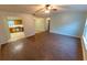 Spacious living room with wood-look floors and ceiling fan at 6006 Nw 62Nd Pl, Ocala, FL 34482