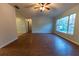 Spacious living area with wood-look floors and large window at 6006 Nw 62Nd Pl, Ocala, FL 34482