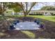 Landscaped backyard with patio seating area at 6460 Sw 111Th St, Ocala, FL 34476