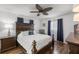 Main bedroom with a comfortable bed and dark wood furniture at 6460 Sw 111Th St, Ocala, FL 34476