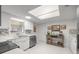 Bright white kitchen features modern appliances and tile backsplash at 6460 Sw 111Th St, Ocala, FL 34476