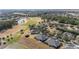 Aerial of homes near golf course and pond at 6716 Sw 91St Cir, Ocala, FL 34481