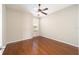 Simple bedroom with hardwood floors and large window at 6716 Sw 91St Cir, Ocala, FL 34481