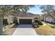 Villa home with 2-car garage and attractive landscaping at 6716 Sw 91St Cir, Ocala, FL 34481